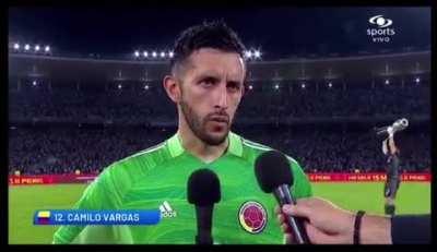 Emiliano Martinez’s post-match celebration as Colombian goalkeeper Camilo Vargas is being interviewed