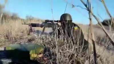 Soldiers of the 228th Ukrainian Territorial Defense Force battalion discovered a Russian position and started firing at them with machine guns.