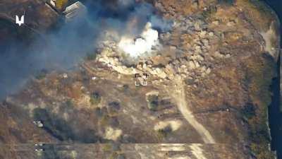 Ua pov American Himars rockets destroys Russian military Ural trucks. Video states they were allegedly carrying Vikhr missiles for the KA-52. Cookoff explosion is seen.