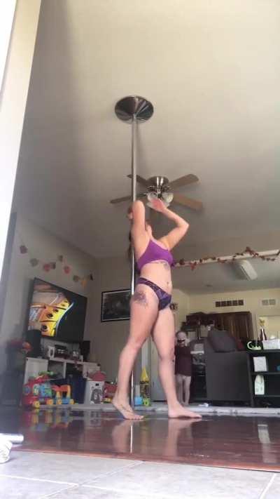 Pole dancing in front of kid