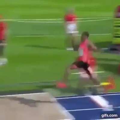 Long jumper nearly jumps the entire pit
