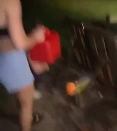 Girls trying to start a bonfire