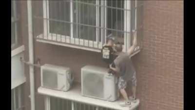 Passerby hero risks life, climbing five stories to save boy with head stuck in window railings