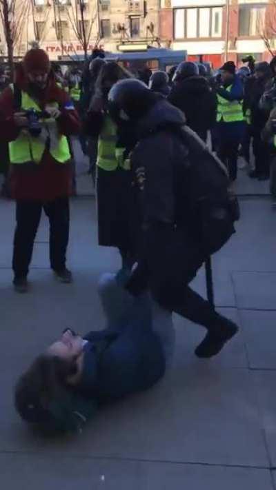 Russian protestors starting to protect each other from visibly nervous police.