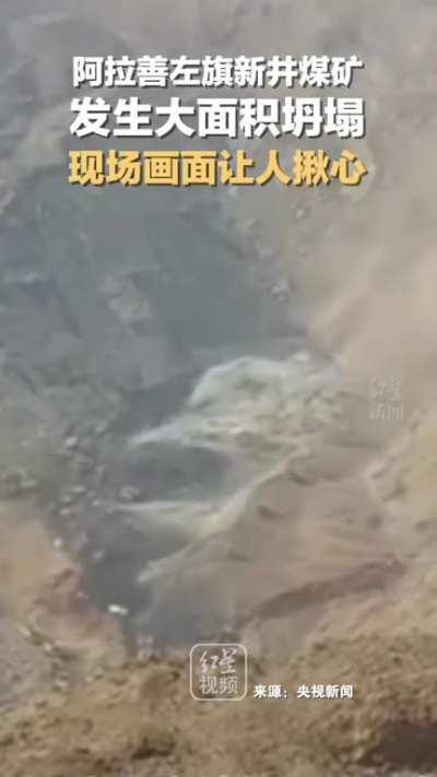 Dozens of trucks were buried by the landslide in a coal mine in Alxa,China
