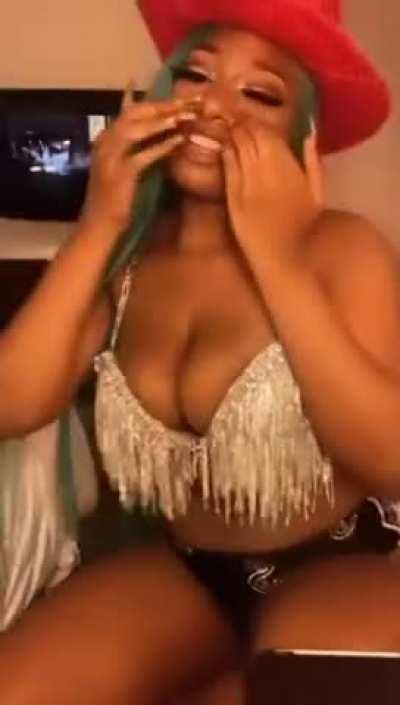 Megan Thee Stallion riding an imaginary cock