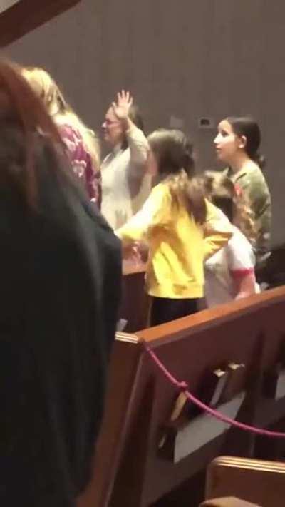 Girl doing Macarena during Sinner’s Prayer