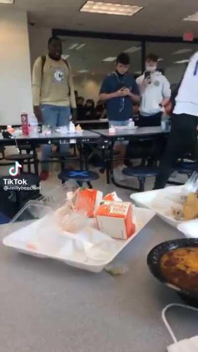 Girl at a High School gets tazered by a Police Officer.