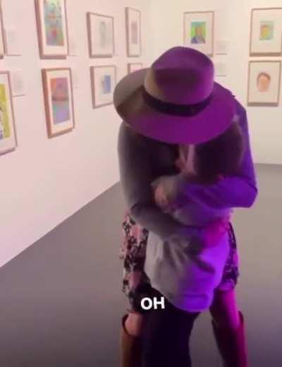 Nephew surprises his aunt with a painting he made of her that earned finalist placement in an art competition