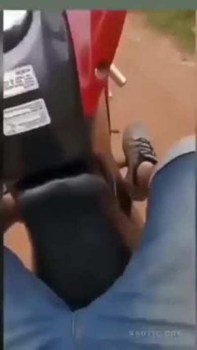 Practising doing wheelstands on a dirt track