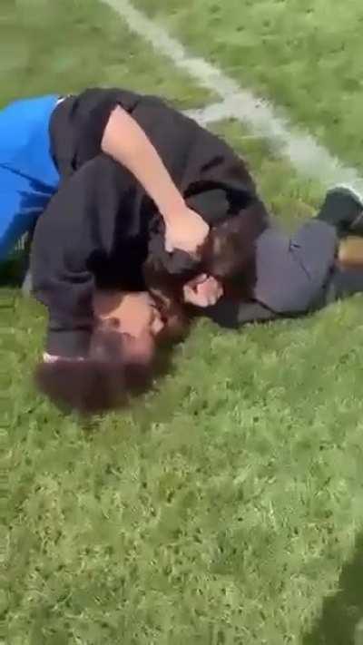 Mauling her on the ground 