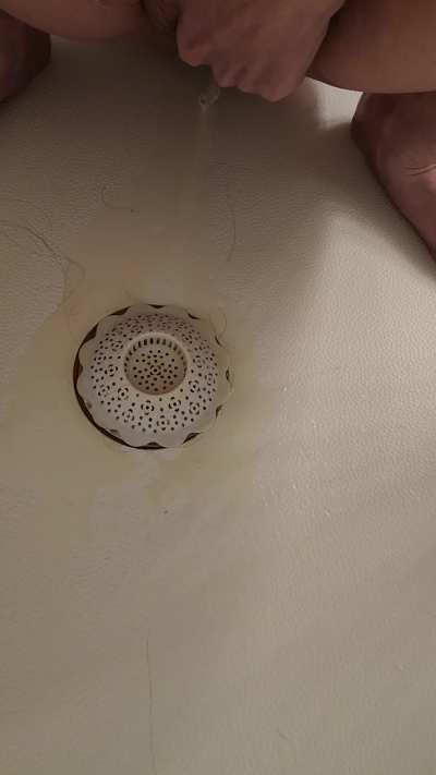 Peeing during my period while squatting in the shower. Tampon leaked. Warning: some period blood.