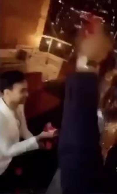 Man proposes to woman after which she grabs her phone to upload a picture on Instagram