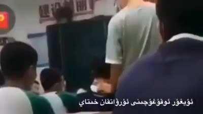 Chinese communist teacher beating ethnic student with no worries.
