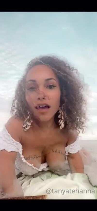 Tanya Tehanna crawls in the sand and shows her sand covered tits