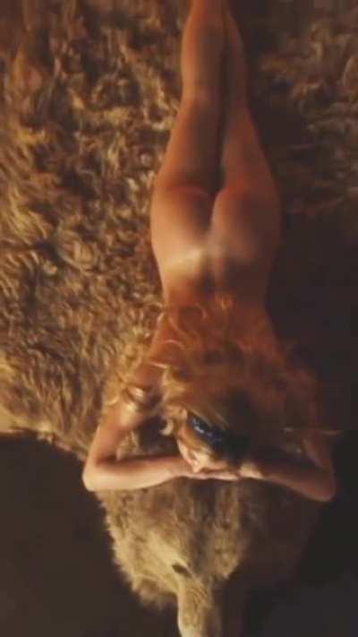 Sydney Sweeney on a bearskin Rug