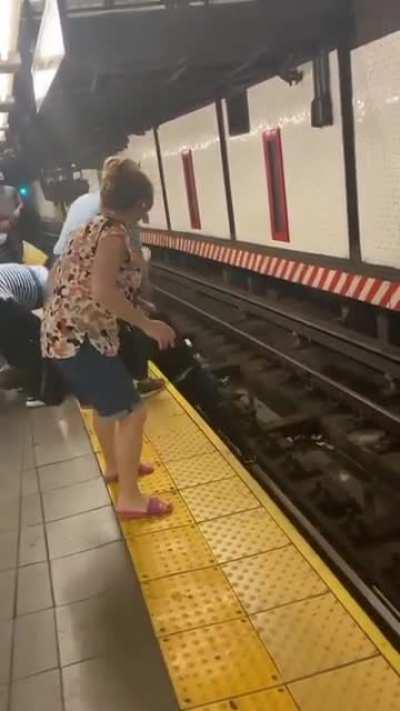 A man has fallen onto the train tracks in Lego city