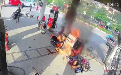 Guy escapes with just minor injuries after car reverses into petrol pump.