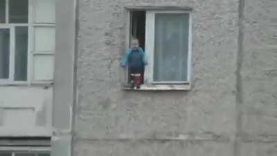 Toddler + open window + tall building