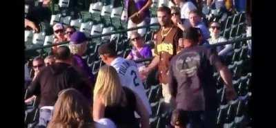 Padres fan knocks out Rockies fan with a cheap shot, gets immediately mobbed