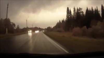 SUV loses control, rolls over on its side and hits author head-on. The 2 drivers are not very lucky.