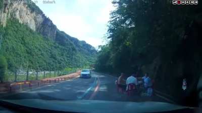 People found having a tabletop card game in the middle of traffic