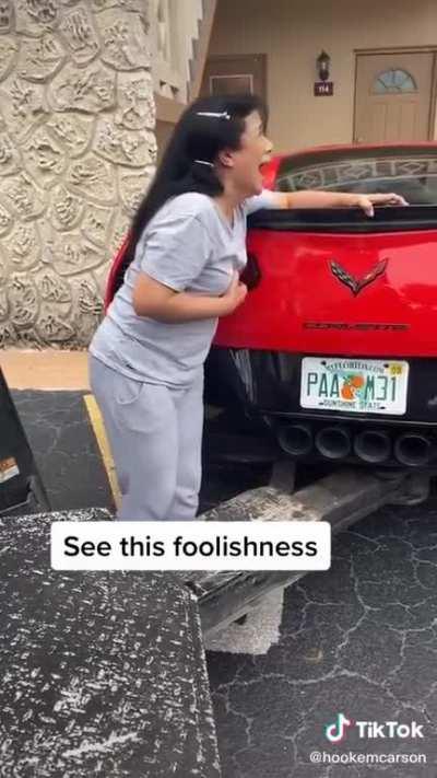 Having a meltdown while her son's is being towed