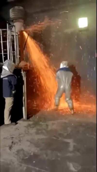 A shrunken me clearing a blockage in my nozzle