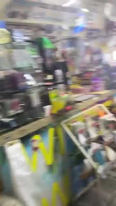 This gas station completely covered in may flies