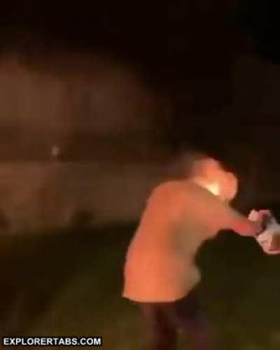 Spitting accelerant point blank into a fire