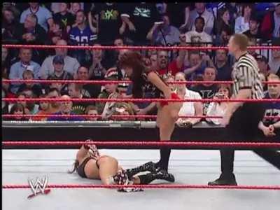 Melina striping down Candice Michelle's panties