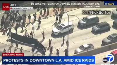 Protesters entering the 101 freeway in Los Angeles. The freeway is now blocked off…