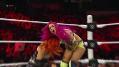 Becky lynch punches Sasha Banks in the stomach