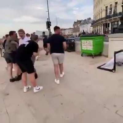 This young girl playing a little 1-on-1 soccer match easily puts the ball past a much older player