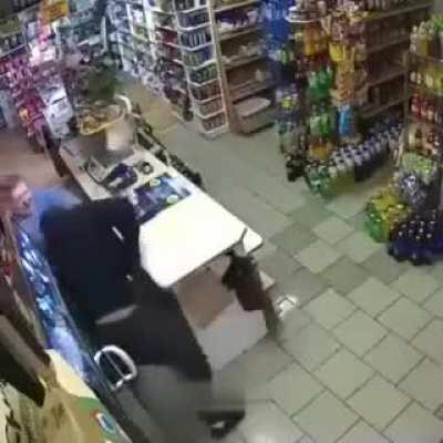 Babushka fights off an armed gunman with a mop