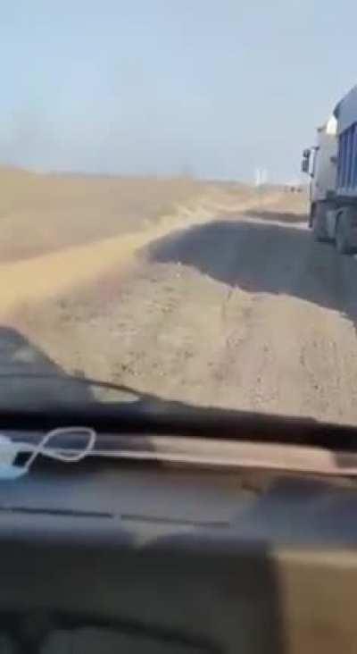 Russian invaders shoot at a civilian vehicle