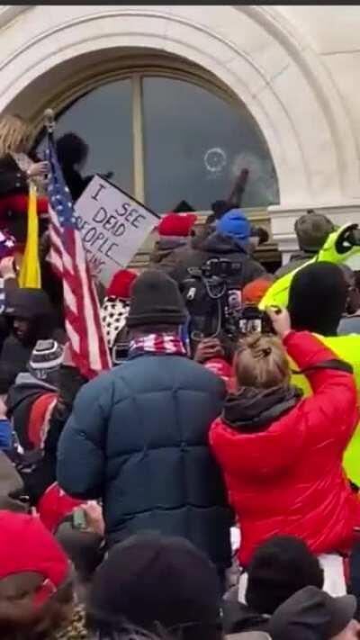 BUSTED! Video shows Trump supporters stopping & pulling away ANTIFA men from breaking the Capitol windows. Trump supporters are heard yelling out “That’s Antifa!!!”