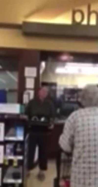 pharmacy manager quits in front of customers warning them not to take the poison after seeing too many people die...