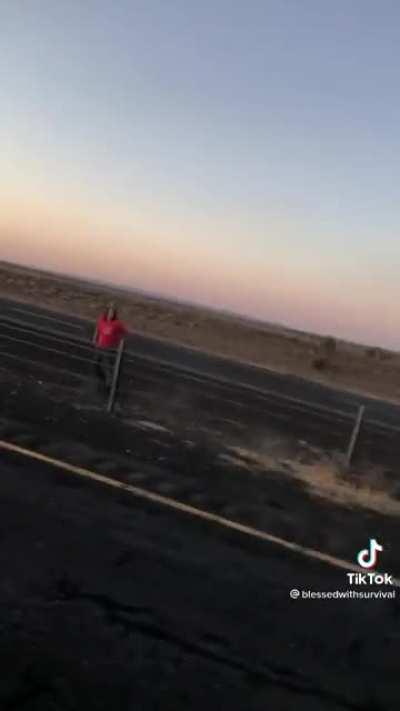 Drunk man leaves his car as a twisted wreck on the highway while walking around in shock