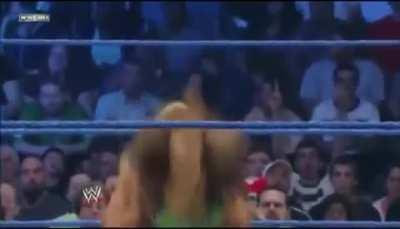 Beth Phoenix laying out AJ Lee with the Glam Slam 