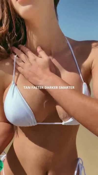 Emily Feld oiling up. (