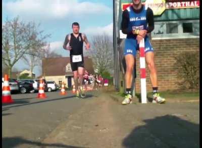 Runner smashes nuts into pole