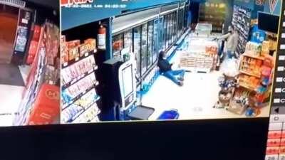 He didn't even have time to pull out the weapon. The masked robber got what he deserved. StupidPrize at its finest