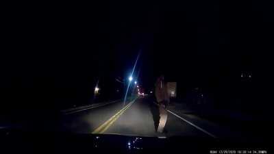 Just walks out from behind delivery truck at night, doesn't even look!