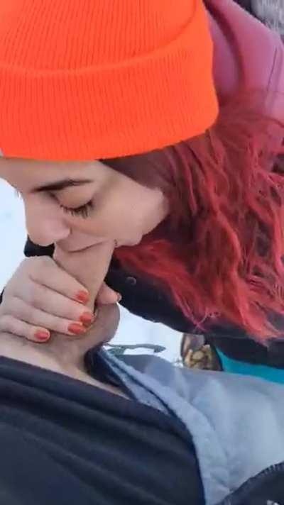 Knelt on the snow to service his cock