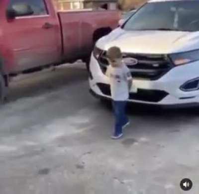 Excited kid rams head into garage door