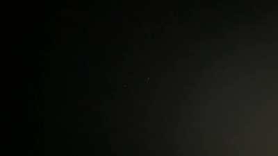 Last night While turning off the sprinklers I saw three unidentified flying objects. When I noticed them they were about 300 yards away sitting in the sky quietly not making a sound. The middle object turned off and then turned back on going dark for abou