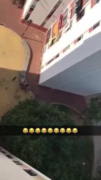 A complete P.O.S throws a bag full of water to scare the kid