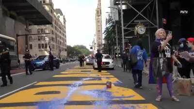 SuperKaren and her friends dumping paint over BLM mural outside Trump Tower