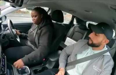 Young lady taking her driving test forgets something important